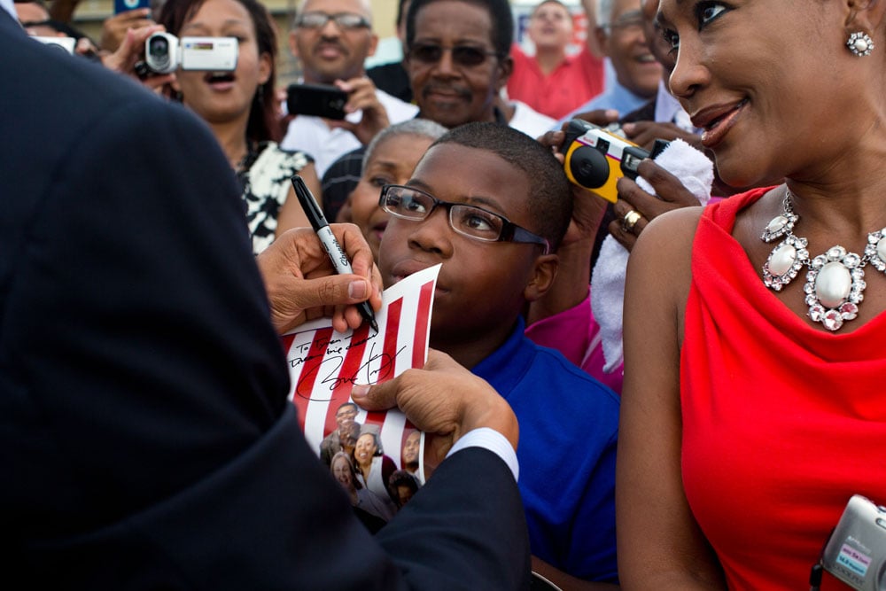 20170111obama8 © President Barack Obama signs a photograph as he greets people on the tarmac upon arrival at Louis Armstrong International Airport in New Orleans, La., July 25, 2012. (Official White House Photo by Pete Souza)
This official White House photograph is being made available only for publication by news organizations and/or for personal use printing by the subject(s) of the photograph. The photograph may not be manipulated in any way and may not be used in commercial or political materials, advertisements, emails, products, promotions that in any way suggests approval or endorsement of the President, the First Family, or the White House. 