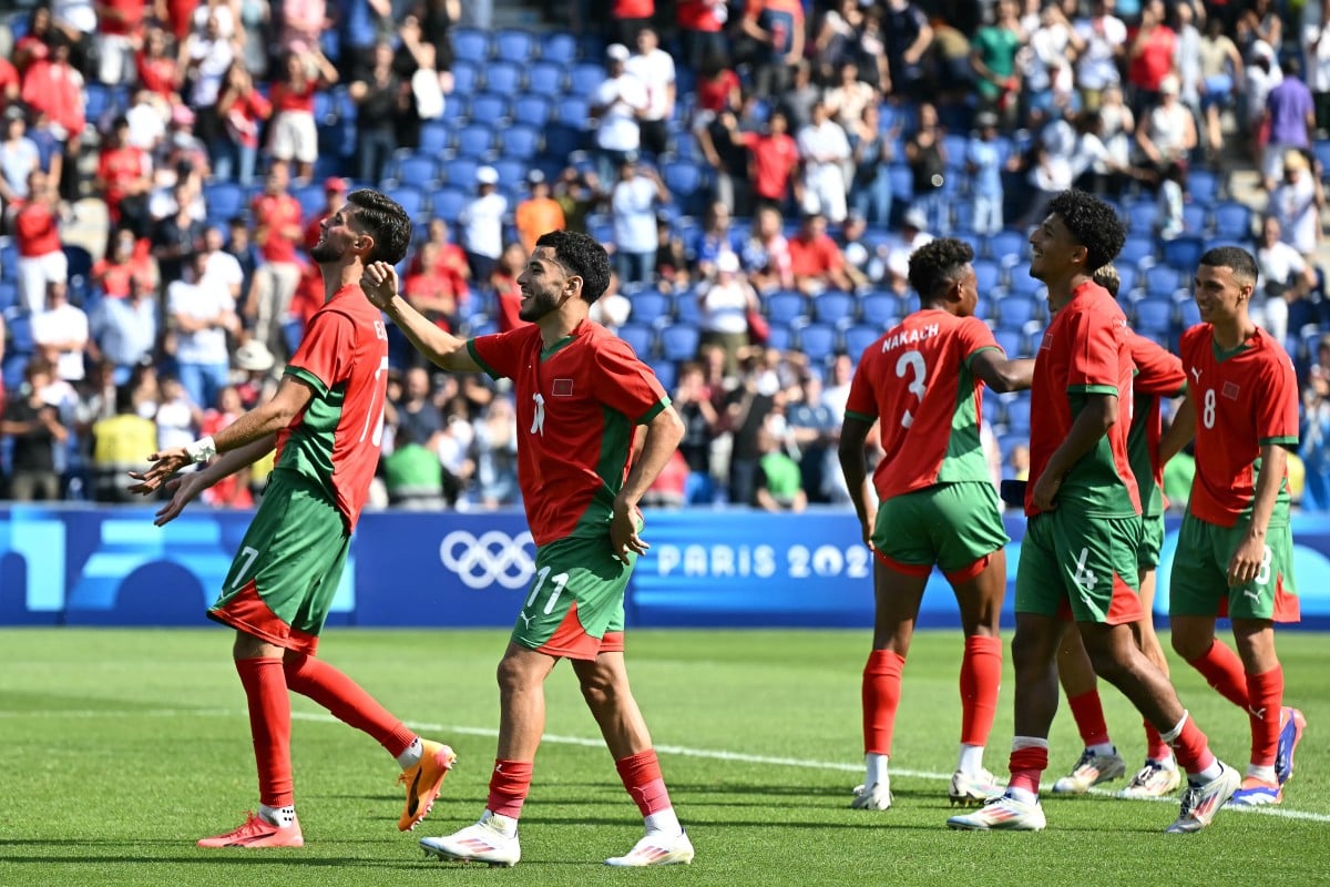 Les joueurs marocains célèbrent leur victoire face aux USA &copy; Paul ELLIS / AFP