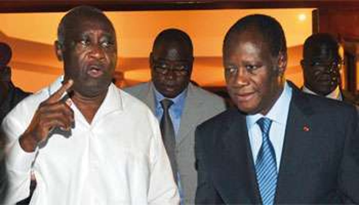 Les résultats du scrutin à Abidjan seront décisifs (L. Gbagbo, à gauche, avec A. Ouattara). © Sia Kambou/AFP