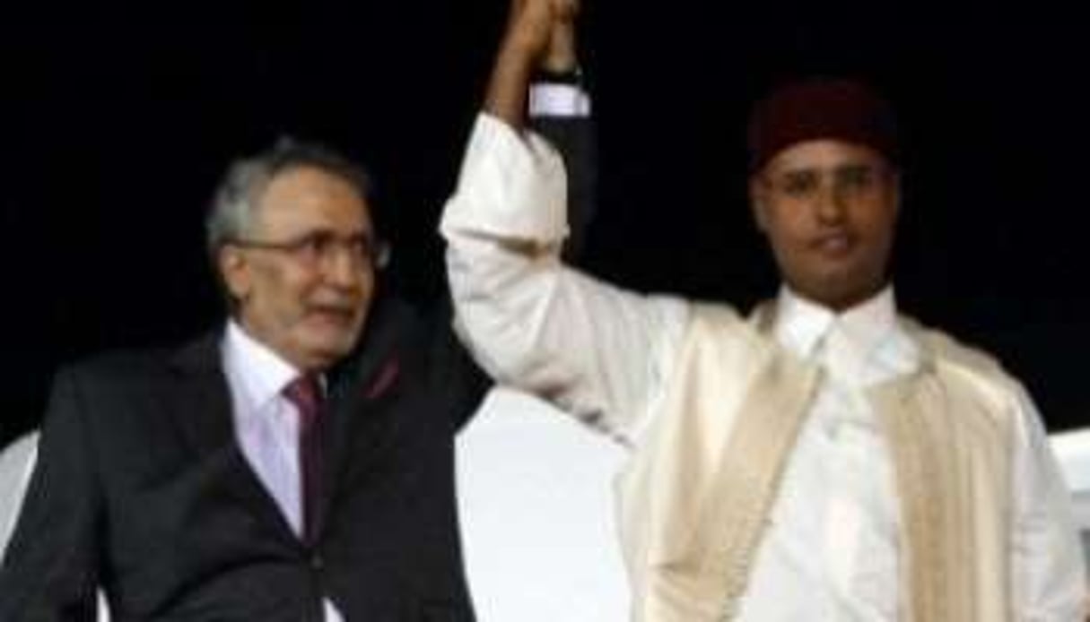 Abdelbaset el-Megrahi et du fils de Mouammar Kaddafi, Seif Al-Islam, le 21 août 2009. © AFP/OYA NEWSPAPER