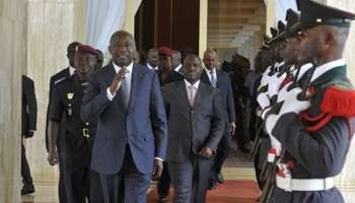 Laurent Gbagbo et Guillaume Soro arrivent au conseil des ministres, le 5 août. © AFP