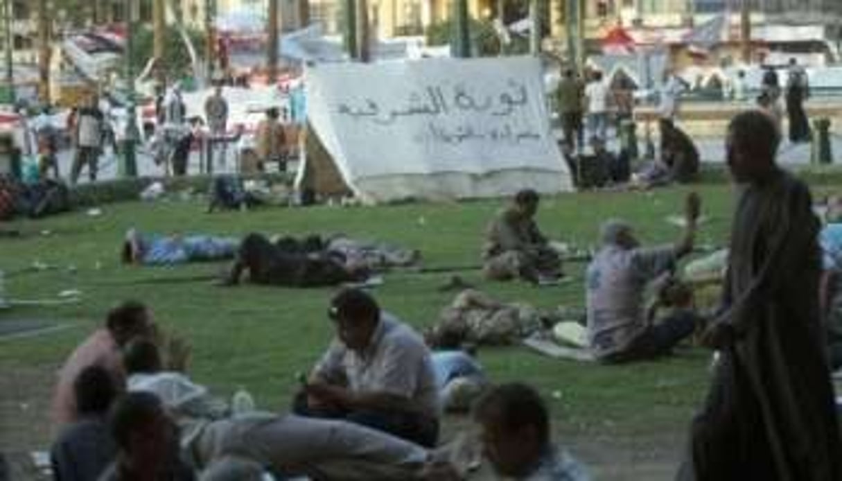 Des protestataires égyptiens en sit-in place Al-Tahrir, le 27 juillet 2011 au Caire. © AFP