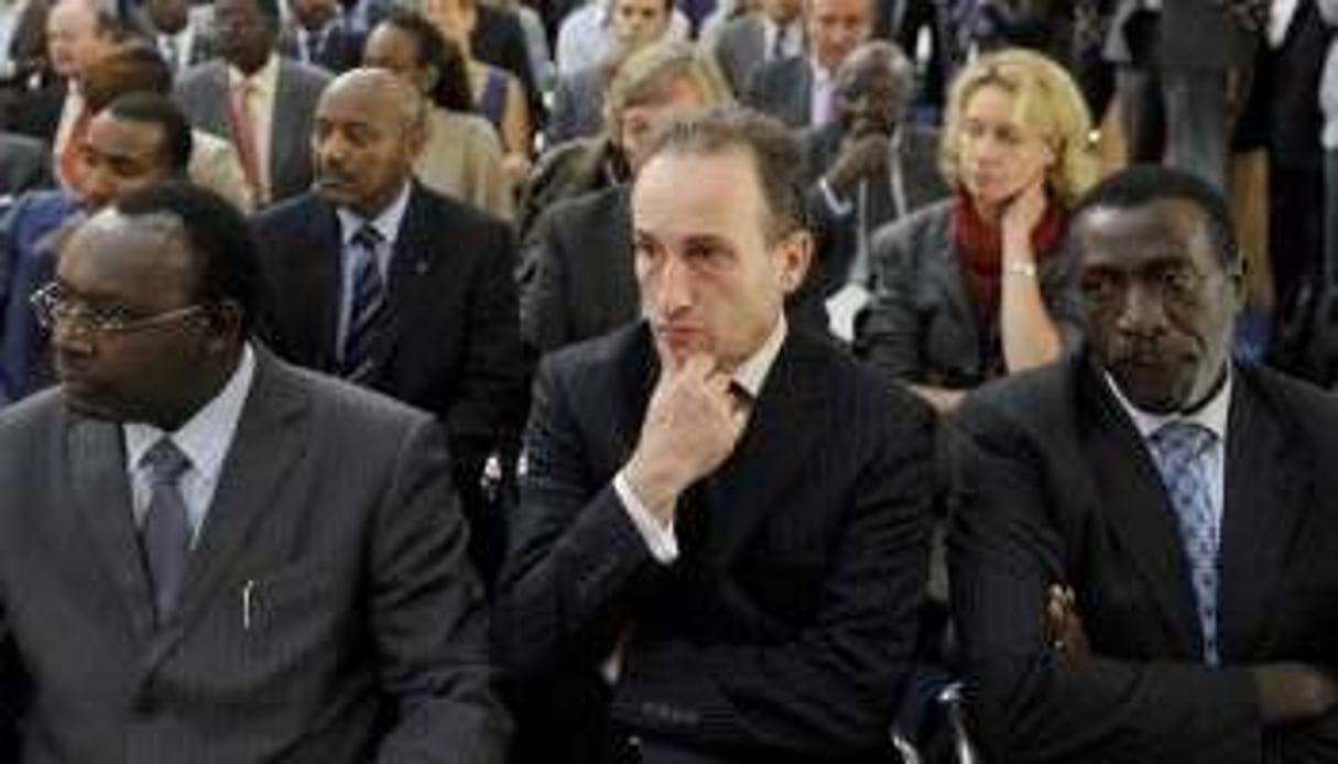 Laurent Contini (C.), lors de la visite de Paul Kagamé en France, le 12 septembre 2011. © Vincent Fournier pour J.A.