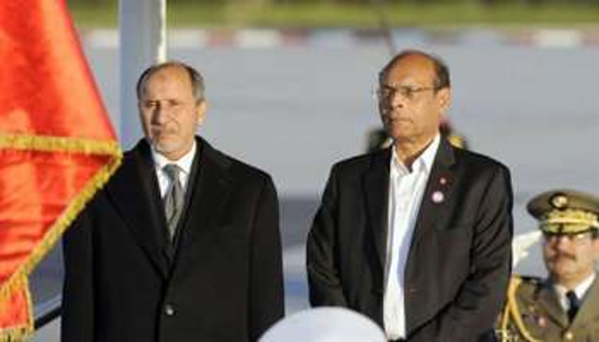 Le président tunisien M. Marzouki (d) et le chef du CNT libyen M. A. Jalil à Tripoli. © AFP