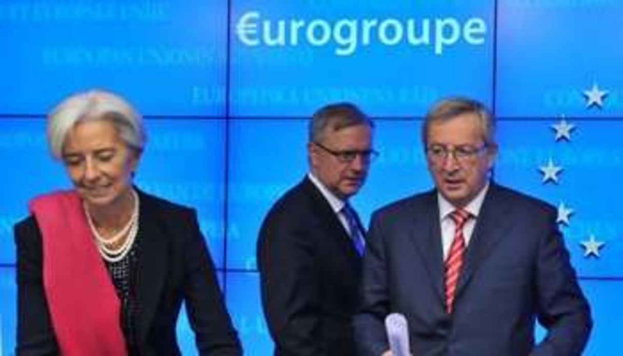 De g. à dr. : C. Lagarde, O. Rehn et J-C. Juncker le 21 février 2011 à Bruxelles. © AFP