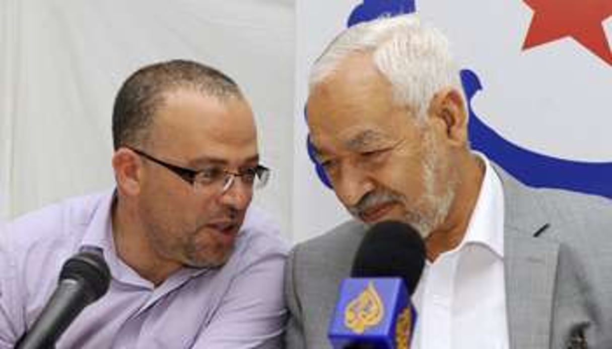 Samir Dilou (à gauche) et Rached Ghannouchi (à droite). © AFP