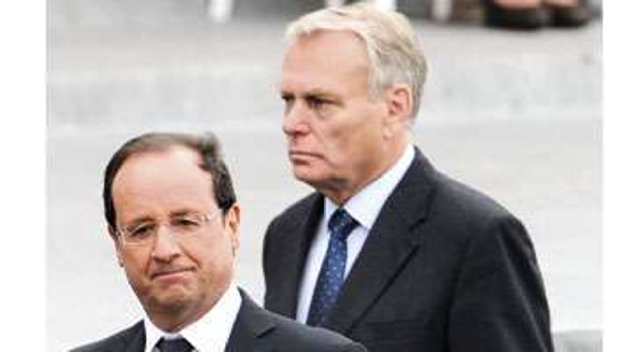 Le nouveau président, avec Jean-Marc Ayrault, son Premier ministre, le 14 juillet dernier. © Witt/Sipa
