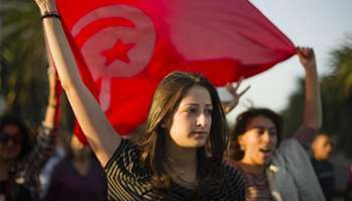 Une jeune manifestante en octobre 2011 à Tunis. © AFP