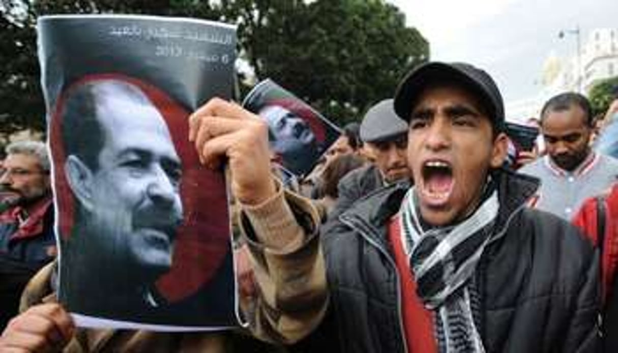 Des portraits de Chokri Belaïd lors d’une manifestation, le 23 février 2013 à Tunis. © AFP