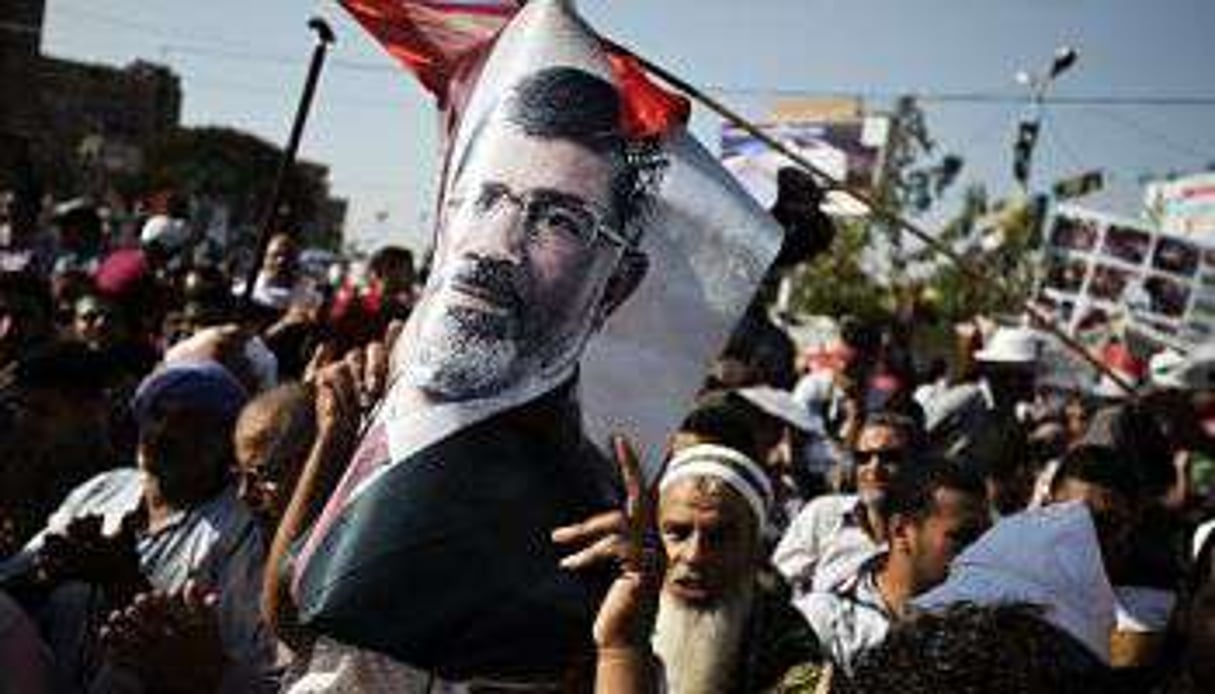Des partisans de Mohamed Morsi manifestent au Caire, le 10 août 2013. © AFP