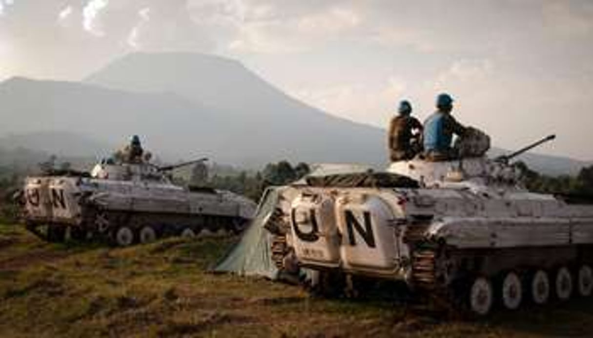 Des soldats de la Monusco assis sur des tanks le 13 août 2012 à Kibati, à 10 km de Goma. © AFP