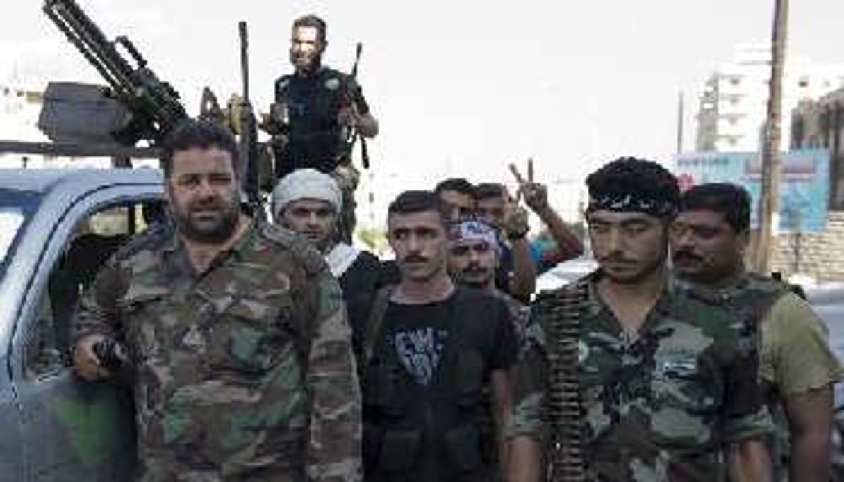 Des membres de la brigade Ahfad al-Rasul le 23 septembre 2012 à Alep. © AFP