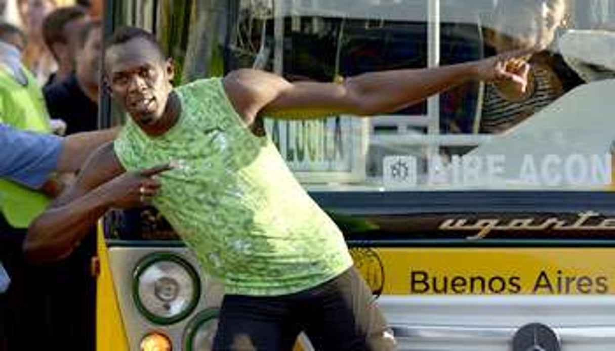 Usain Bolt après une course contre un bus en Argentine en décembre 2013. © Juan Mabromata/AFP