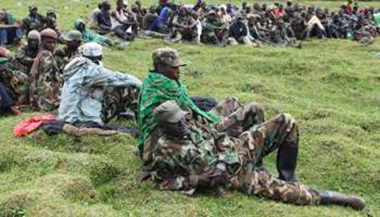 Des rebelles du M23 qui ont fui au Rwanda, le 16 mars 2013. © AFP