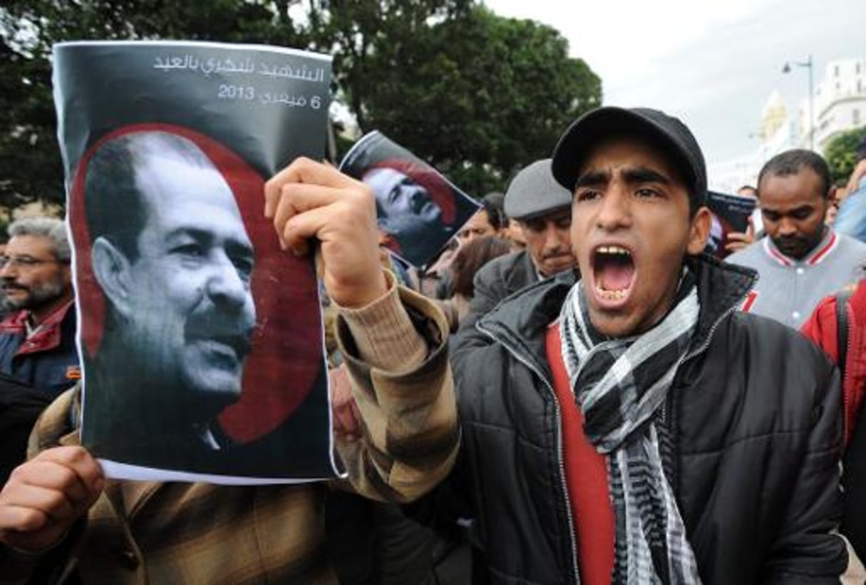 Des portraits de Chokri Belaïd lors d’une manifestation, le 23 février 2013 à Tunis. © AFP