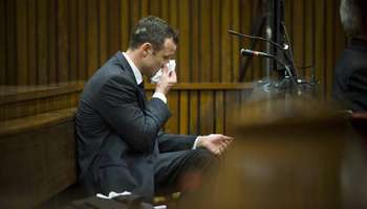 Oscar Pistorius dans son box, au tribunal à Pretoria le 7 mars 2014. © AFP