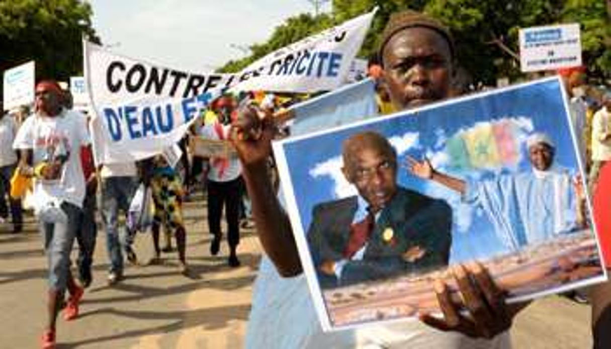 Un partisan de l’ancien président Abdoulaye Wade le 8 octobre 2013 à Dakar. © AFP