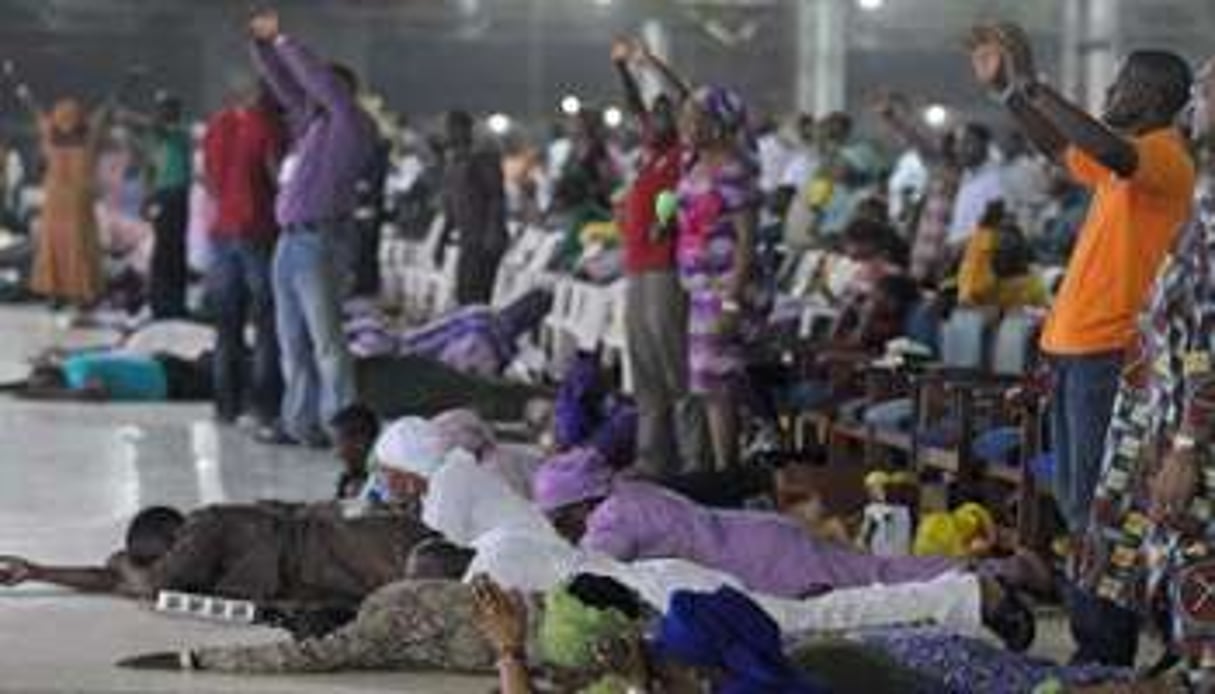 Des Chrétiens dans une église de Lagos le 1er janvier 2014. © AFP