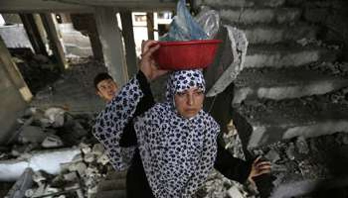 Une femme palestinienne après une frappe israélienne, le 13 juillet 2014 à Gaza. © AFP