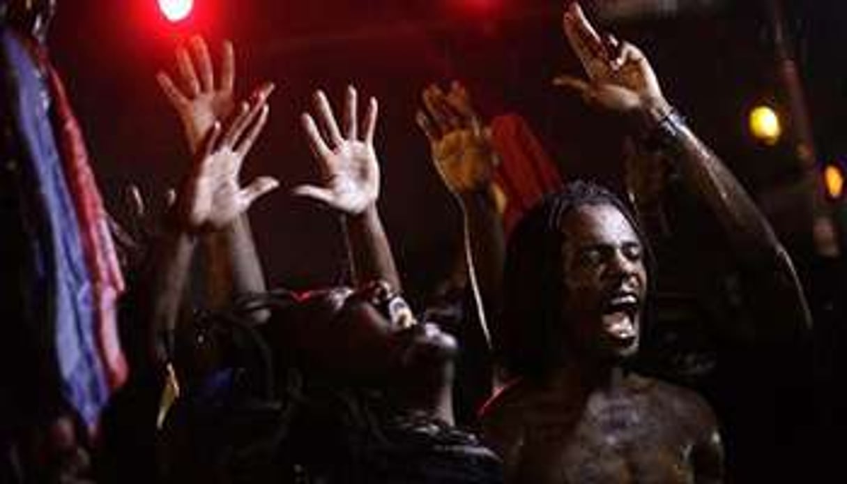 Des manifestants rassemblés dans les rues de Ferguson, le 16 août 2014. © AFP