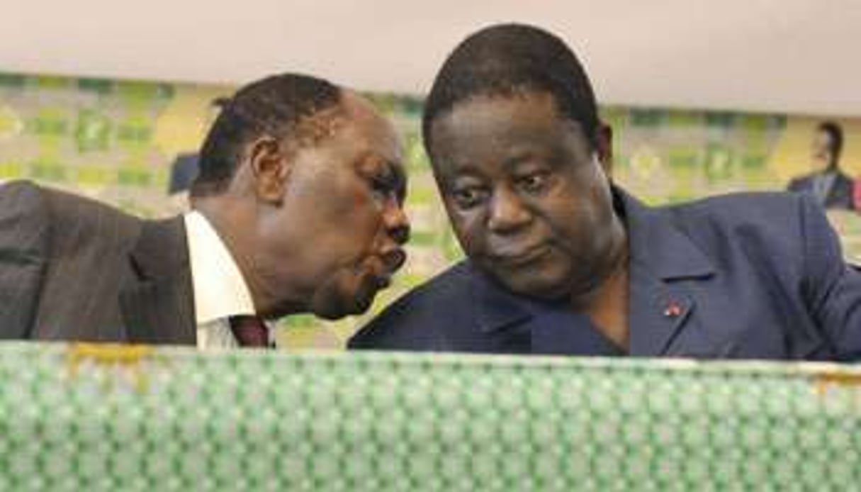 Alassane Dramane Ouattara (g.) et Henri Konan Bédié. © AFP