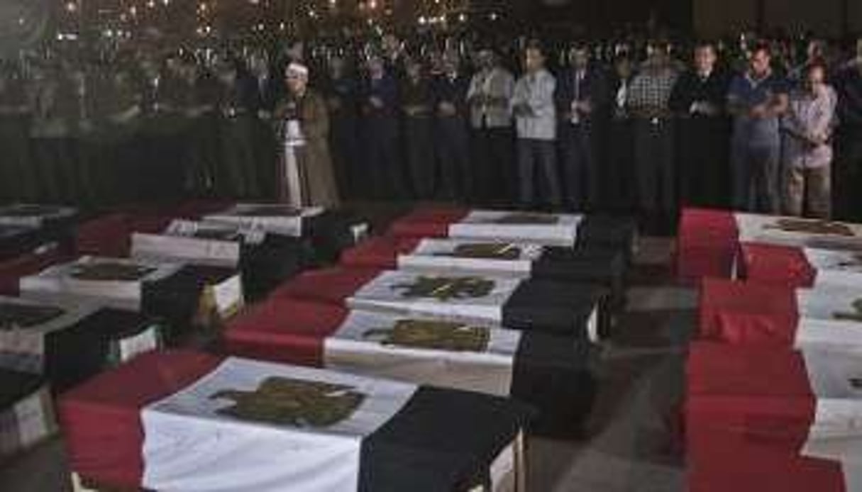 Cérémonie le 19 août 2013 à la mémoire des 25 policiers tués. © AFP