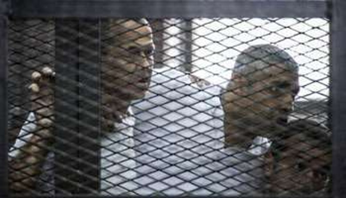 Les journalistes australien Peter Greste, canado-égyptien Fadel Fahmi et égyptien Baher Mohamed. © AFP