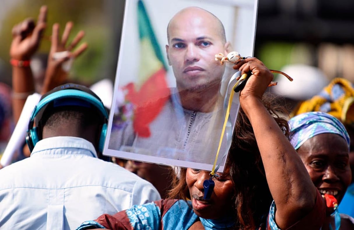 L’affaire Karim Wade continue…à Genève. © Seyllou/AFP