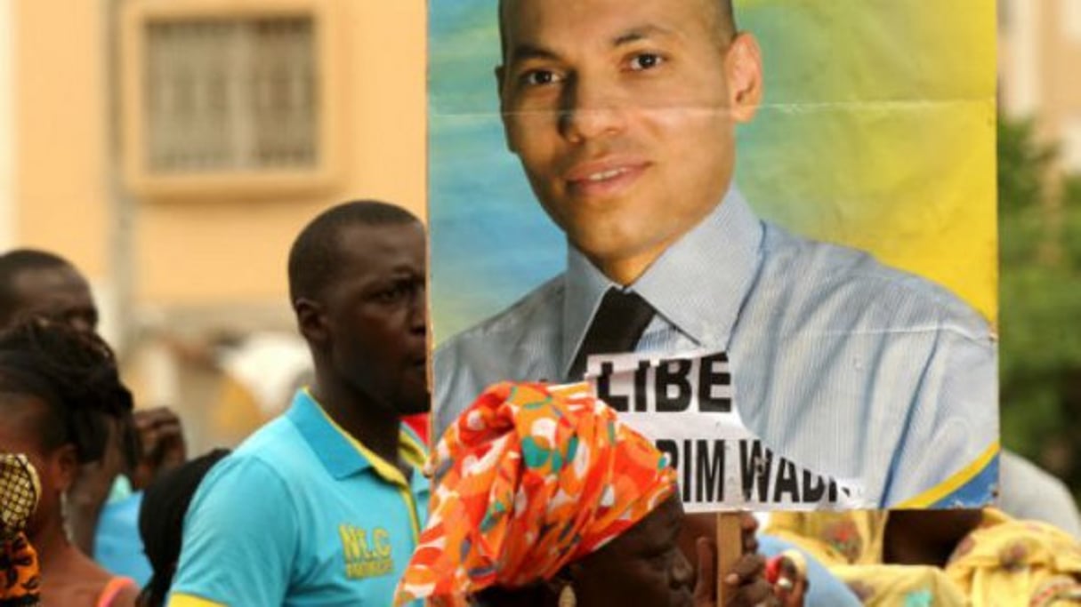 Manifestation pour la libération de Karim Wade en octobre 2013 à Dakar. © AFP