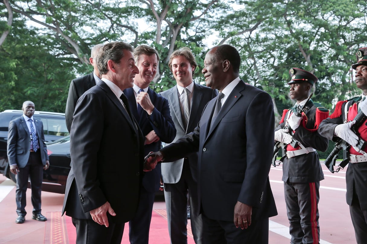 Nicolas Sarkozy, Sébastien Bazin, Cyrille Bolloré et Alassane Ouattara, le 20 juin. © ARISTIDE/présidence de la république