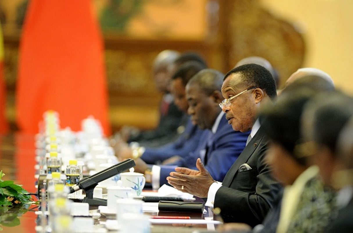 Le président Denis Sassou Nguesso et quelques membres du gouvernement congolais, le 12 juin 2014 à Pékin. © Wang Zhao/AP/SIPA