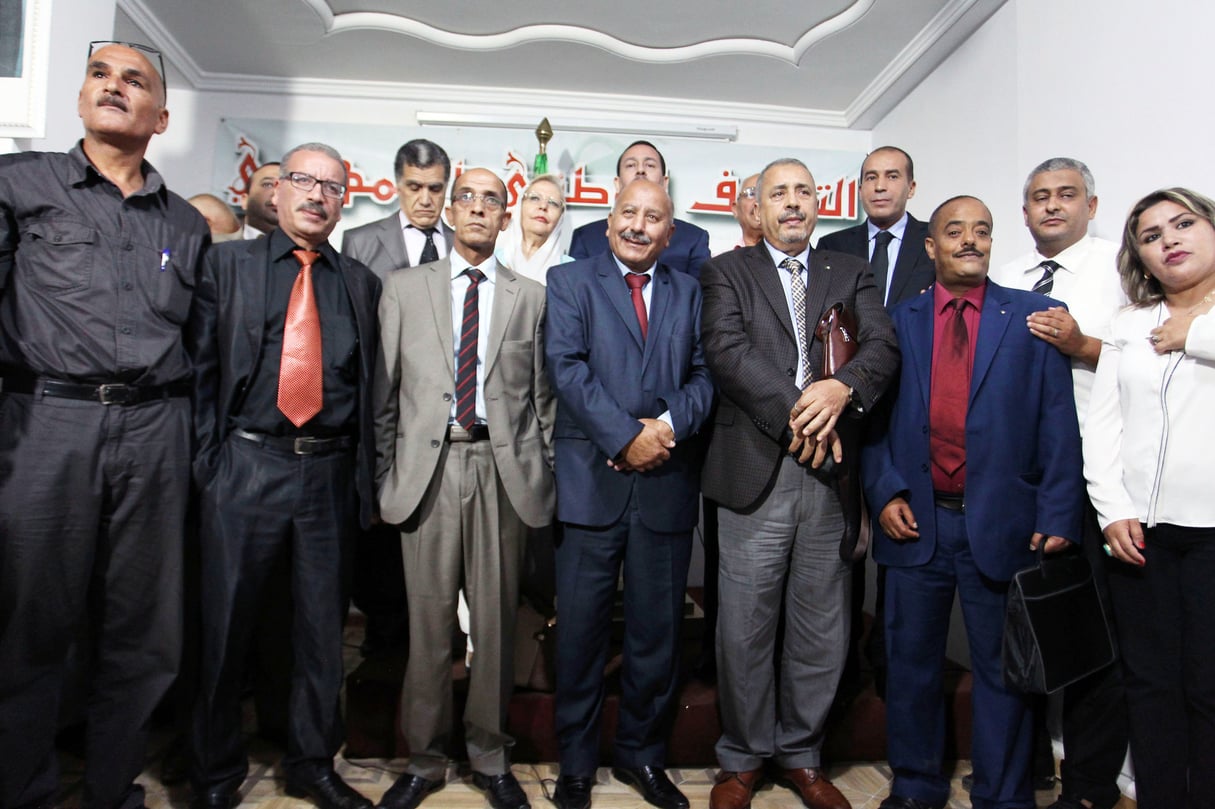 Les responsables des quinze petites formations qui défendent la candidature du président sortant, le 15 août, à Alger. &copy; Anis Belghoul/NewPress PPAGENCY/SIPA PRESS