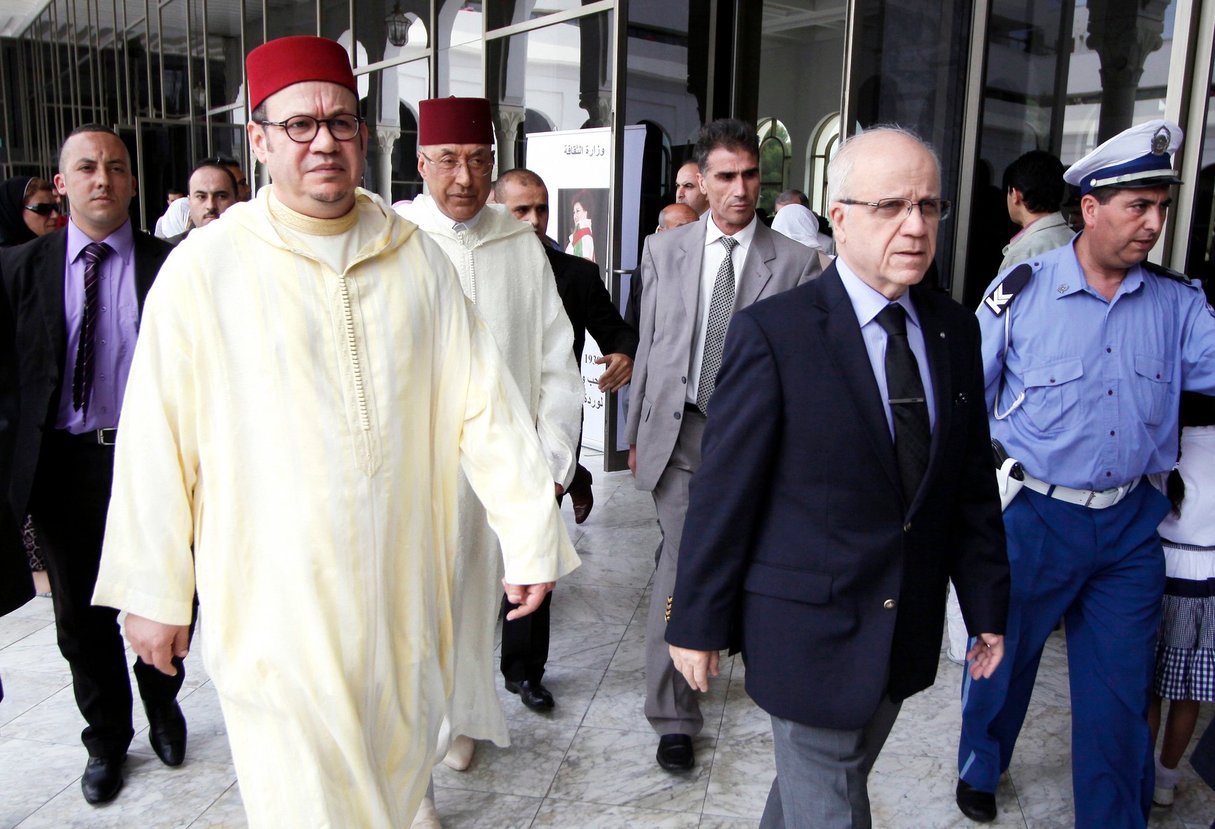 Advisor of Moroccan King Mohammed VI, Fouad el Himma (L), and Algerian minister of Foreign Affairs, Mourad Medelci (R), arrive to pay respect to late Algerian singer Warda Al-Jazairia, one of the most famous singers in the Arab world, on May 19, 2012, in Algiers. Algerian singer Warda, whose powerful vocal range and patriotic songs earned her legendary status throughout the Arab world, died of a heart attack in Cairo late on May 17, at the age of 72, her family said. AFP PHOTO / (Photo by STR / AFP) &copy; AFP