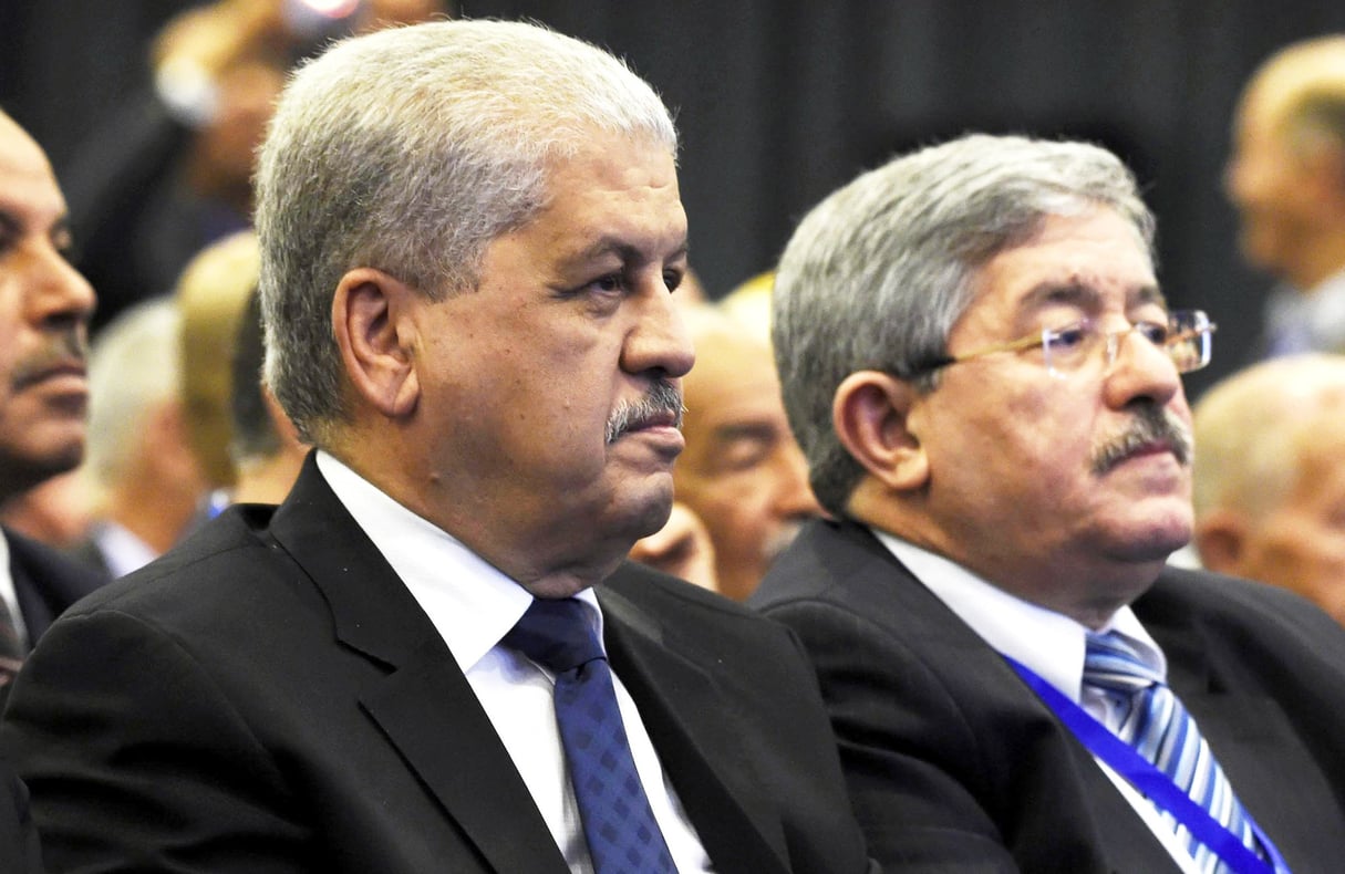 Les deux anciens Premiers ministres Abdelmalek Sellal (à g.) et Ahmed Ouyahia. &copy; Farouk Batiche/AFP