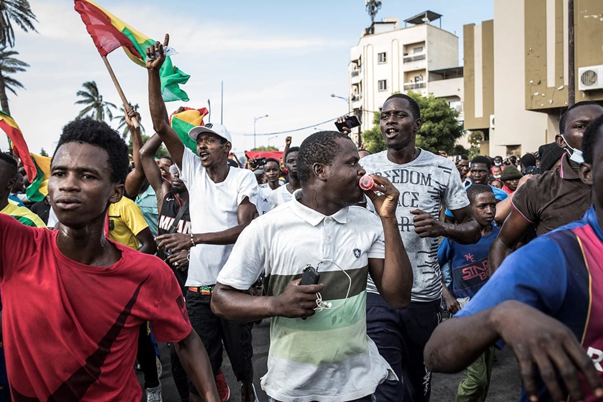 Des opposants guinéens au président Alpha Condé manifestent à Dakar, au Sénégal, le 30 octobre 2020. © JOHN WESSELS/AFP