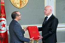 Kaïs Saïed reçoit le président de l’Instance supérieure indépendante pour les élections (Isie), Farouk Buasker, au palais de Carthage, à Tunis, le 13 février 2024. © Tunisan Presidency/ Handout / Anadolu via AFP