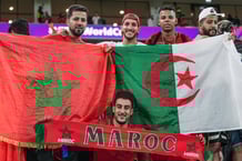 Fans of Morocco and Algeria in emotion celebrate the historic qualification of Morocco to the semi finals of the competition during the FIFA WORLD CUP QATAR 2022 football match between Morocco and Portugal at Al Thumama stadium on December 10, 2022 at Doha.