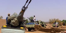 Des membres d’un groupe armé dans des véhicules, à Kidal, au Mali, le 13 juillet 2016. © SOULEYMANE AG ANARA / AFP