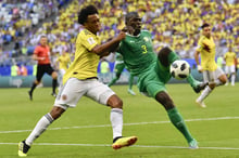 Le Sénégalais Kalidou Koulibaly (à droite), face au Colombien Juan Cuadrado, lors de la Coupe du monde de football 2018. © Martin Meissner/AP/SIPA