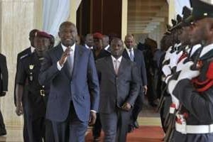 Laurent Gbagbo et Guillaume Soro arrivent au conseil des ministres, le 5 août. © AFP
