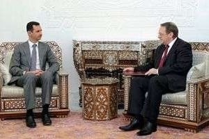 Mikhail Bogdanov (D), vice-ministre russe des Affaires étrangères, et Bachar el-Assad. © AFP