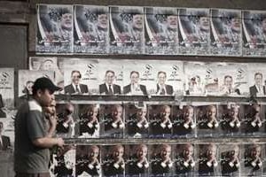 Les murs du Caire sont couverts par les affiches des candidats à la présidentielle. © Gianluigi Guercia/AFP