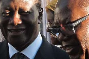 Le président ivoirien Alassane Ouattara (g.) et le président de l’Acnoa, Lassana Palenfo. © Mathieu Olivier pour J.A.