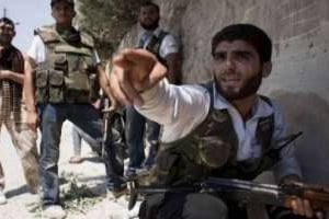 Des rebelles syriens, le 17 août 2012 à Alep. © AFP