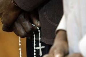 Des catholiques assistent à une messe. © AFP