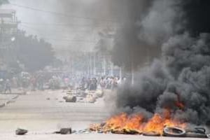 Affrontement entre opposants et policiers à Lomé le 21 août. © AFP