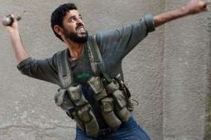 Un insurgé syrien lors de combats contre l’armée à Alep, le 27 octobre 2012. © AFP