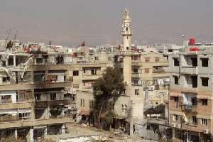 Photo fournie par l’agence Sana le 26 janvier 2013 d’immeubles détruits à Daraya. © Sana/AFP