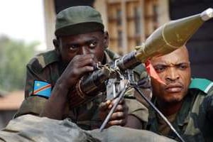 Des officiers des FARDC le 24 juillet 2013 à Kanyaruchinya, à 15km de Goma. © AFP