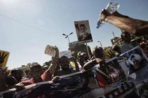 Des partisans de Mohamed Morsi manifestent au Caire le 23 août 2013 en faveur du président déchu. © AFP
